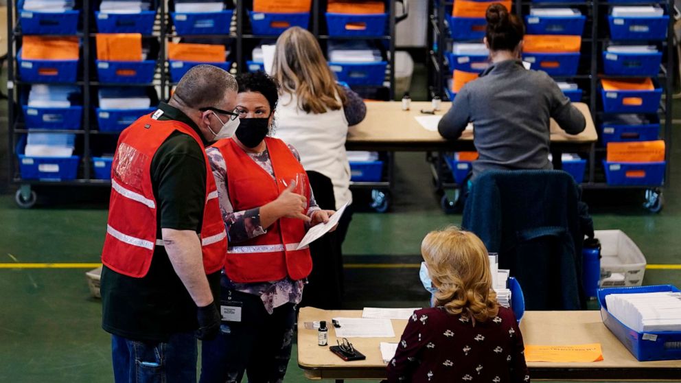 PHOTO: Election workers check mail-in and absentee ballots for the 2020 General Election  at West Chester University, Nov. 3, 2020, in West Chester, Pa.