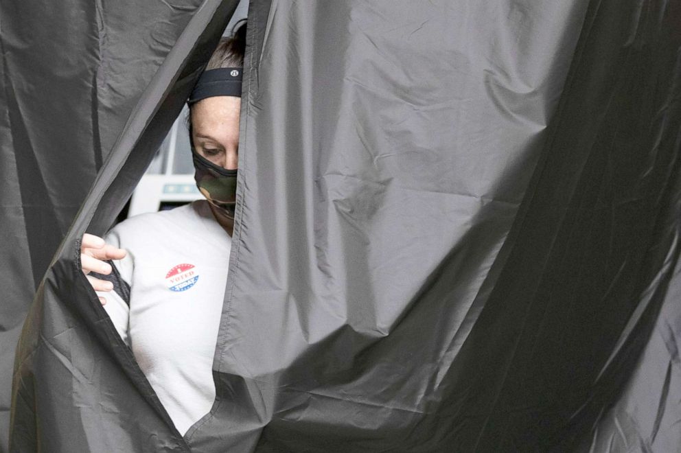 PHOTO: A voter steps from the voting booth after casting her ballot in the Pennsylvania primary in Philadelphia, June 2, 2020. 