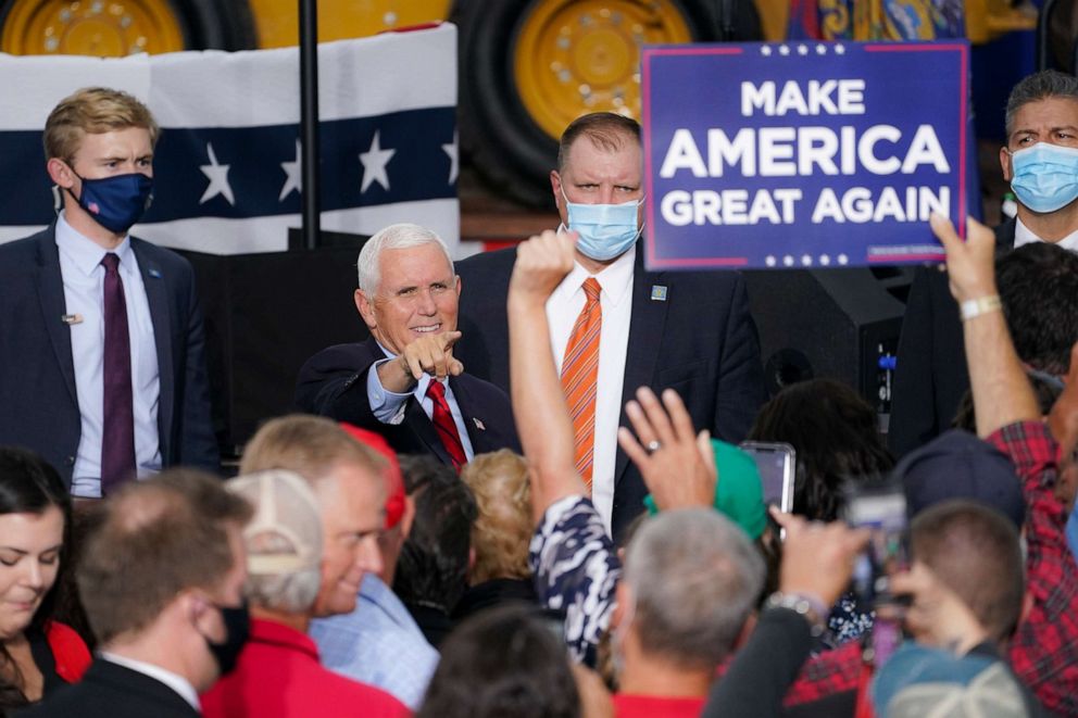PHOTO: Vice President Mike Pence greets the audience crowd after speaking at a campaign event on the grounds of Kuharchik Construction, Inc. in Exeter, Pa., Sept. 1, 2020