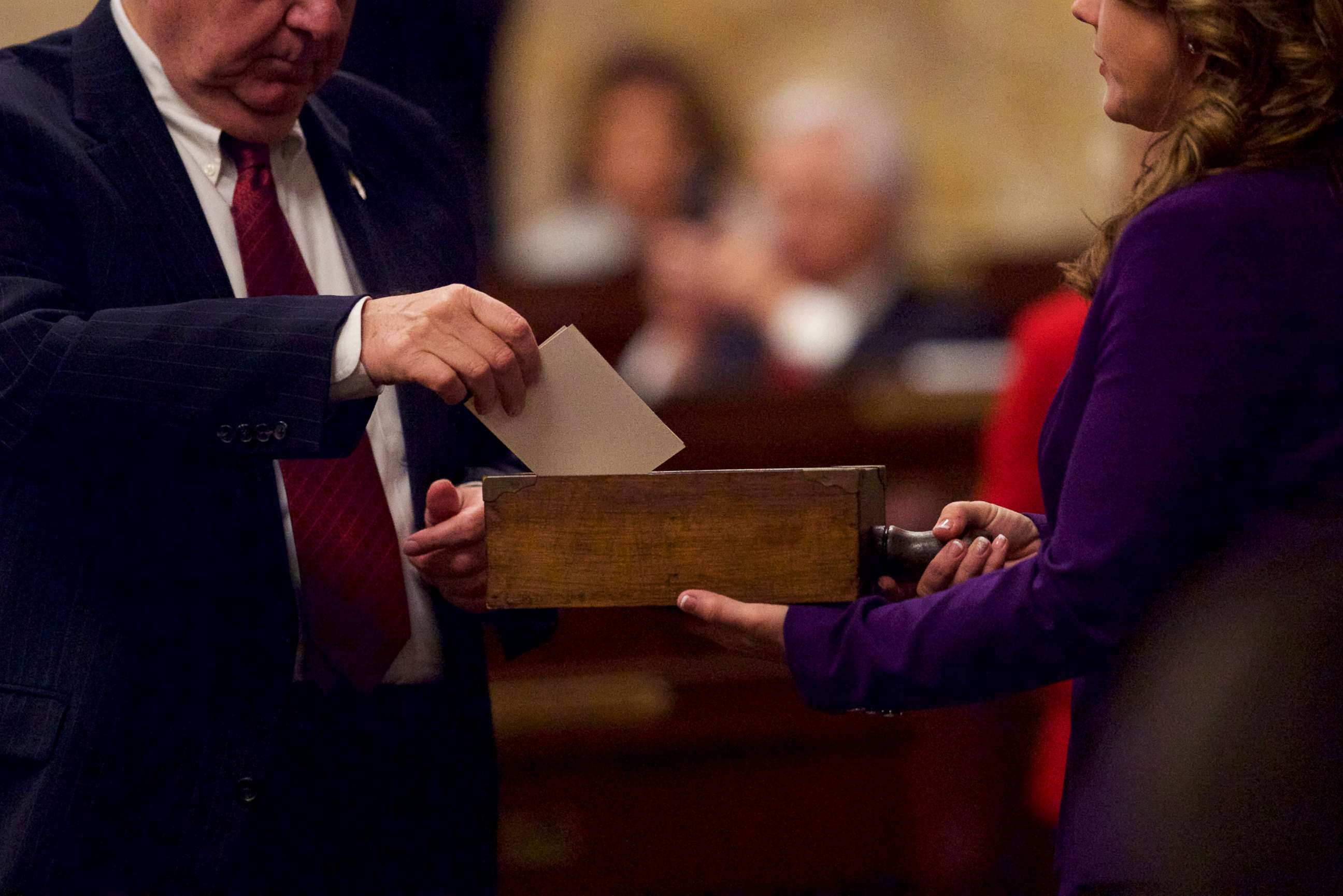 PHOTO: In this Dec. 19, 2016, file photo, an elector places his signed ballot into a ballot box within the House of Representatives chamber of the Pennsylvania Capitol Building in Harrisburg, Penn.