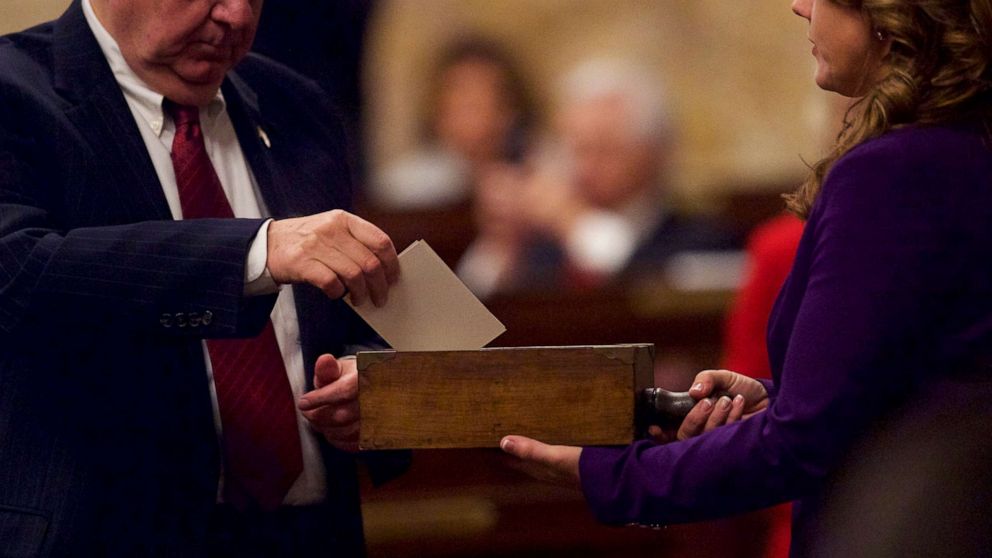 PHOTO: In this Dec. 19, 2016, file photo, an elector places his signed ballot into a ballot box within the House of Representatives chamber of the Pennsylvania Capitol Building in Harrisburg, Penn.