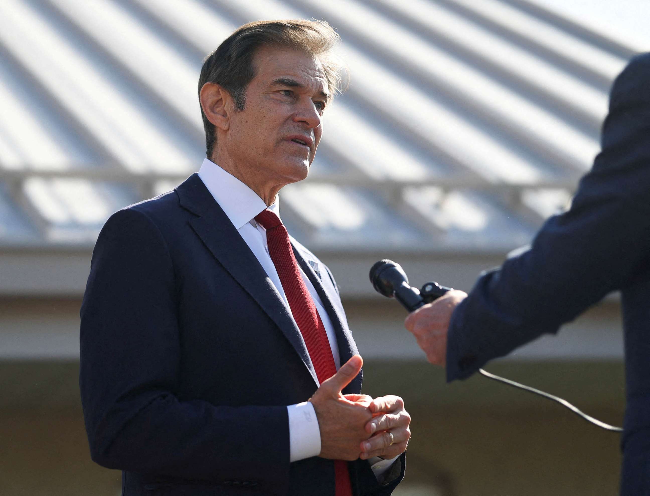 PHOTO: Pennsylvania Republican U.S. Senate candidate Dr. Mehmet Oz is being interviewed after he cast his vote in Bryn Athyn, Pa., May 17, 2022. 
