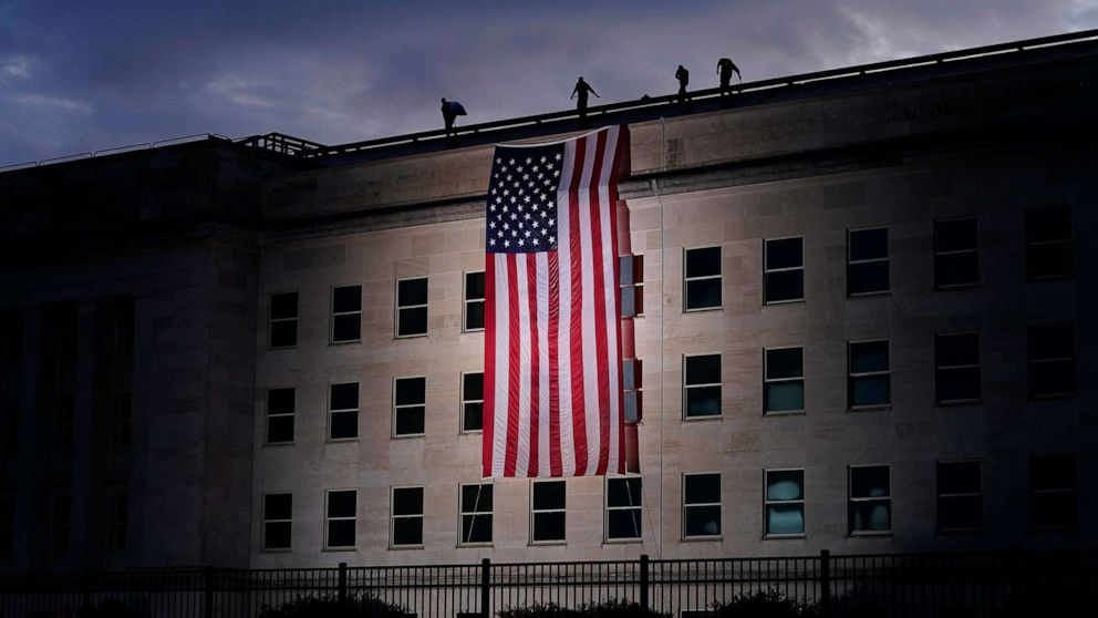 PHOTO: A large American flag is unfurled at the Pentagon ahead of ceremonies at the National 9/11 Pentagon Memorial to honor the 184 people killed in the 2001 terrorist attack on the Pentagon, in Washington, Sept. 11, 2020.