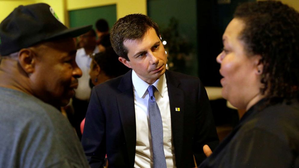 PHOTO: South Bend Mayor and 2020 presidential candidate Pete Buttigieg talks with Samuel Brown and his daughter Jasmine Brown after meeting with community leaders to discuss policing policies in the community in South Bend, Ind., July 1, 2019.