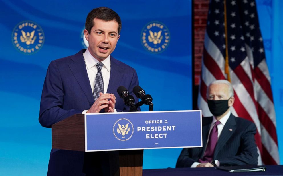 PHOTO: Former Democratic presidential candidate Pete Buttigieg speaks as U.S. President-elect Joe Biden looks at Biden's transition headquarters on Dec. 16, 2020, in Wilmington, Del.