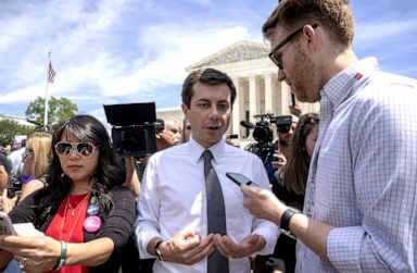 PHOTO: Democratic presidential candidate and mayor of South Bend, Indiana Pete Buttigieg speaks to a reporter at a pro-choice rally at the Supreme Court on May 21, 2019, in Washington, D.C.