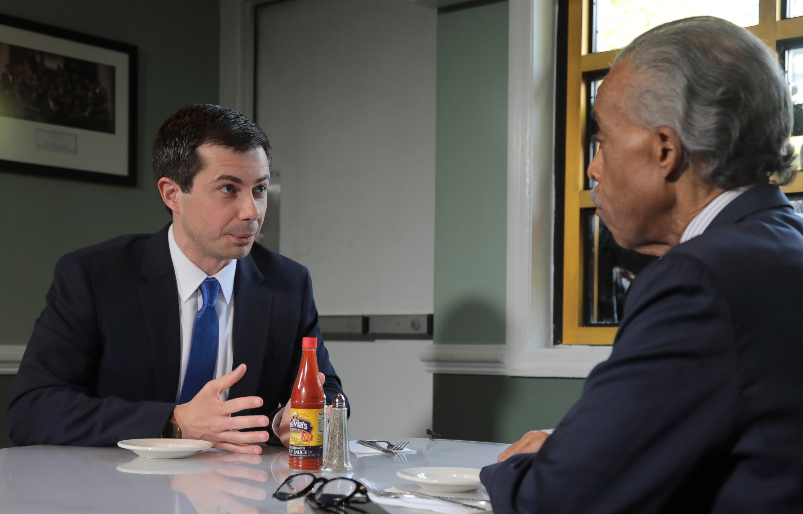 PHOTO: Democratic presidential candidate Mayor Pete Buttigieg, from South Bend, Indiana, and civil rights leader Rev. Al Sharpton, right, hold a lunch meeting at Sylvia's Restaurant in Harlem, New York, Monday, April 29, 2019.