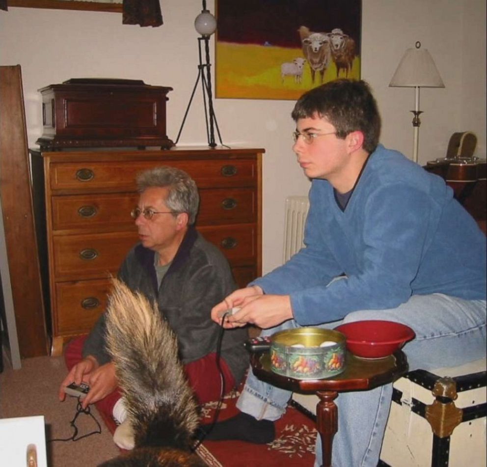 PHOTO: Pete plays a video game with his dad.