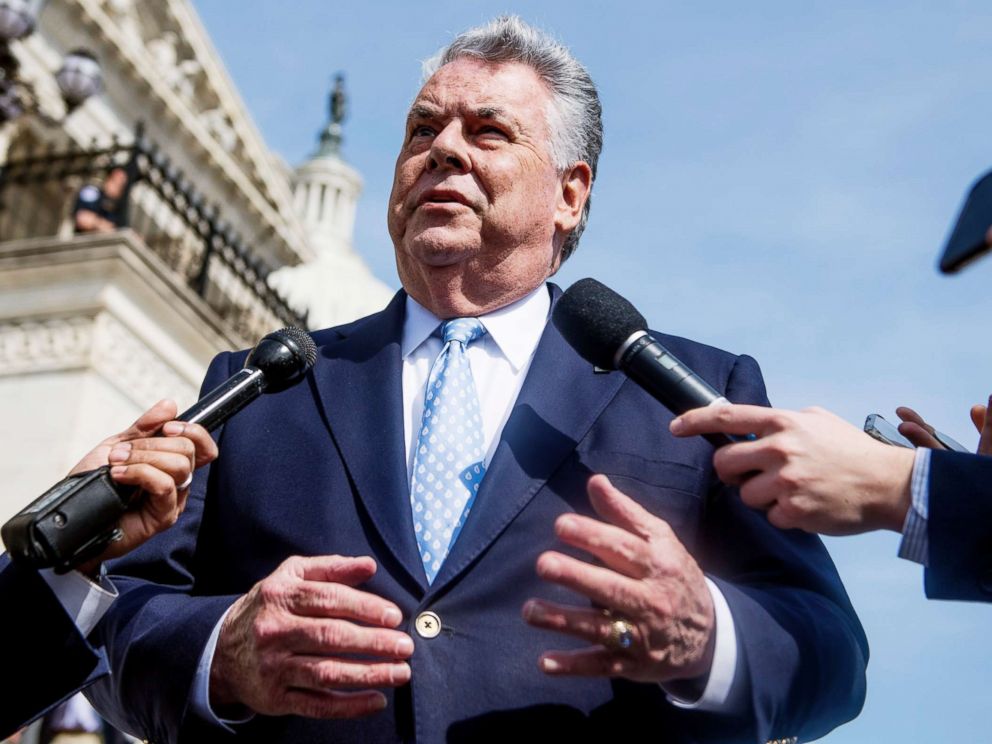 PHOTO: Rep. Peter King talks with reporters at the base of the House steps after the last votes of the week on April 13, 2018.