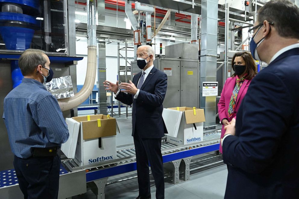 PHOTO: President Joe Biden, with Michigan Gov. Gretchen Whitmer, tours COVID-19 vaccine freezers at a Pfizer manufacturing site on Feb. 19, 2021, in Portage, Mich.