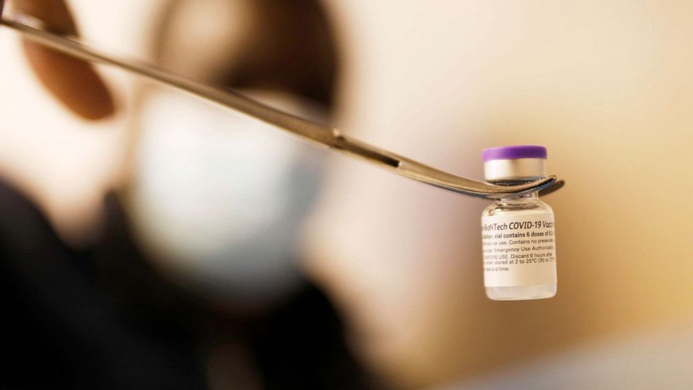 PHOTO: A vial containing roughly 6 doses of the Pfizer COVID-19 vaccine is displayed in Vernon, Calif., March 23, 2021.