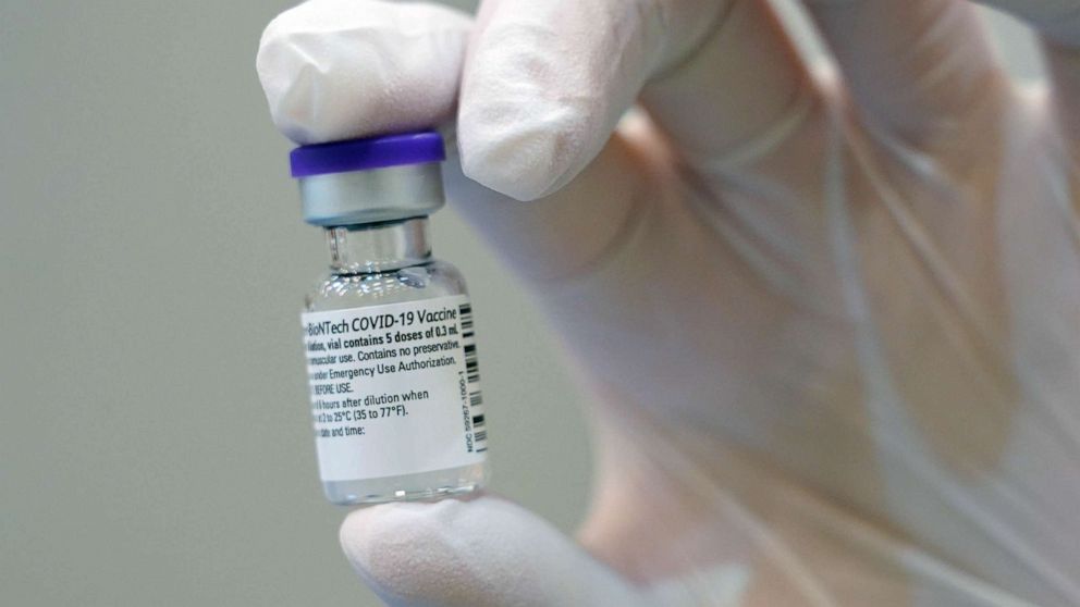 PHOTO: A doctor holds up a bottle of the Pfizer/BioNTech vaccine against Covid-19 at the vaccination center on Jan. 5, 2021 in Potsdam, Germany.