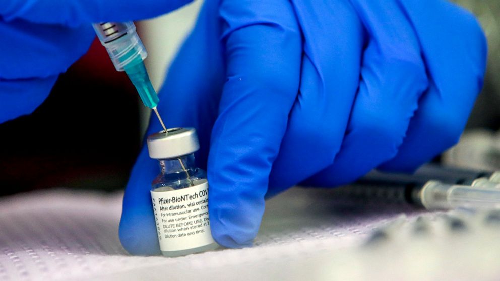 PHOTO: A medical professional preparers a Pfizer COVID-19 vaccine vial at a mobile vaccine clinic held at Roosevelt Park on May 14, 2021 in Los Angeles.