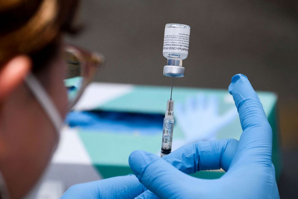 PHOTO: A syringe is filled with a first dose of the Pfizer Covid-19 vaccine at a mobile vaccination clinic during a back to school event in Los Angeles, Aug. 7, 2021.