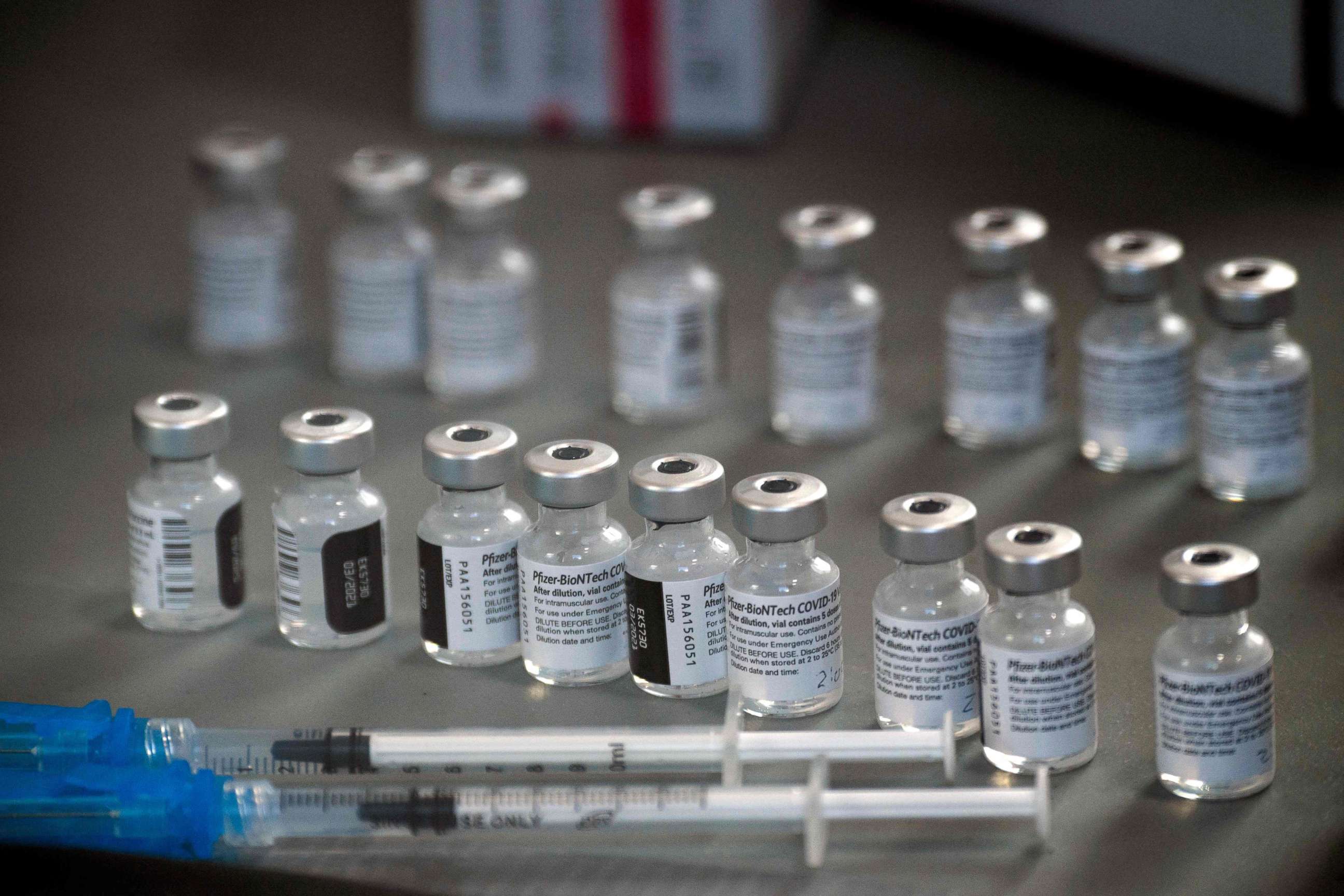 PHOTO: Syringes and vials of the Pfizer-BioNTech Covid-19 vaccine are prepared to be administered in Reno, Nevada, on Dec. 17, 2020.