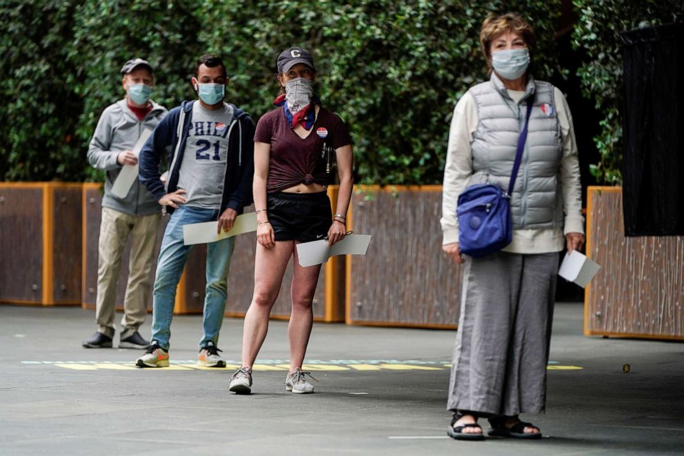 PHOTO: People wait to vote in the primary election in Philadelphia, June 2, 2020.