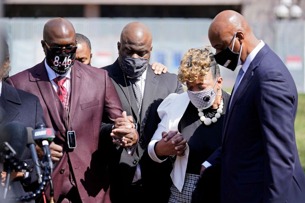 Philonise Floyd, left, the brother of George Floyd and other family members along with Gwen Carr, the mother of Eric Garner, take part in a prayer vigil outside the Hennepin County Government Center on April 6, 2021, in Minneapolis.