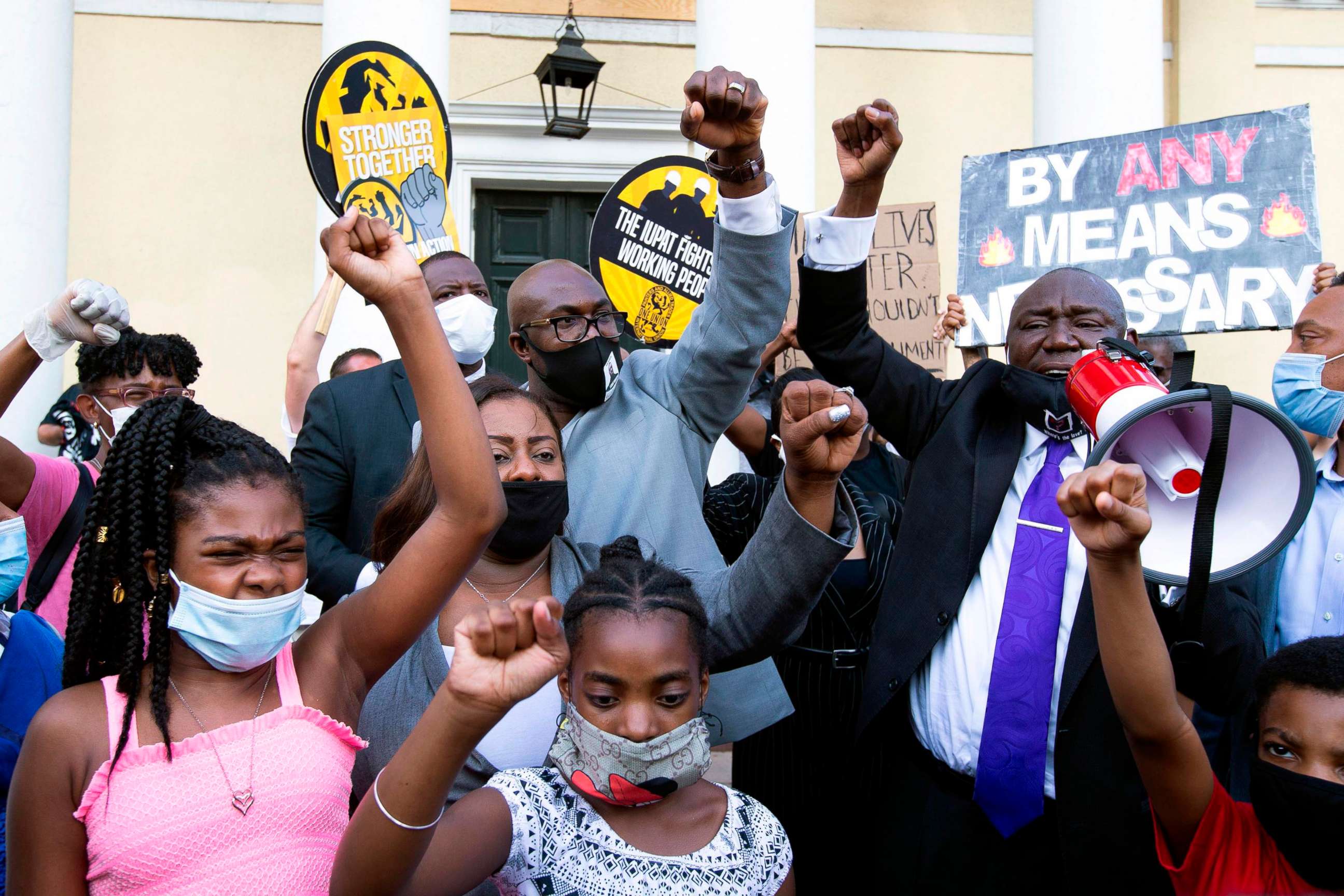 PHOTO: Philonise Floyd (C), brother of George Floyd, accompanied by Benjamin Crump (R), Floyd family attorney and others rally outside of St. Johns Episcopal Church.