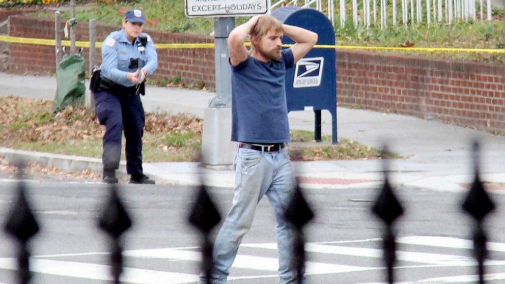 PHOTO: Edgar Maddison Welch surrenders to police in Washington, Dec. 4, 2016. Welch fired an assault rifle inside a pizza restaurant while investigating a child sex ring conspiracy theory. He is set to be sentenced in federal court on Sept. 3. 2020.