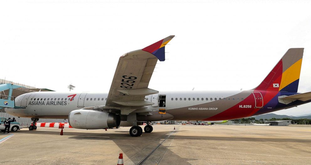 PHOTO: An Asiana Airlines plane after one of plane's doors was opened, sits parked at Daegu International Airport in Daegu, South Korea, May 26, 2023.