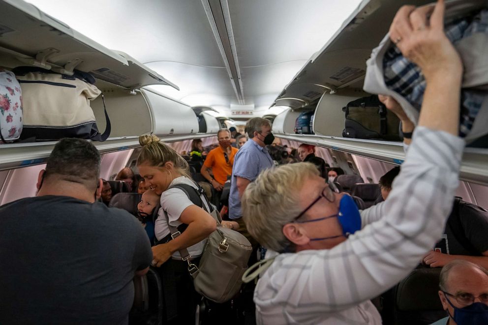 PHOTO: Travelers wait to offload their flight at Portland International Airport on July 11, 2022 in Portland, Oregon.