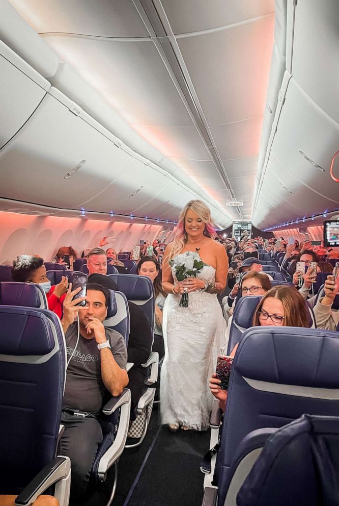 PHOTO: Pam and Jeremy Salda were traveling to Las Vegas to get married when their flight was cancelled. With the help of the pilot's captain, flight crew and other passengers, the two were married about 37,000 feet in the air