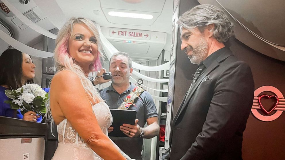 PHOTO: Pam and Jeremy Salda were traveling to Las Vegas to get married when their flight was cancelled. With the help of the pilot's captain, flight crew and other passengers, the two were married about 37,000 feet in the air. 