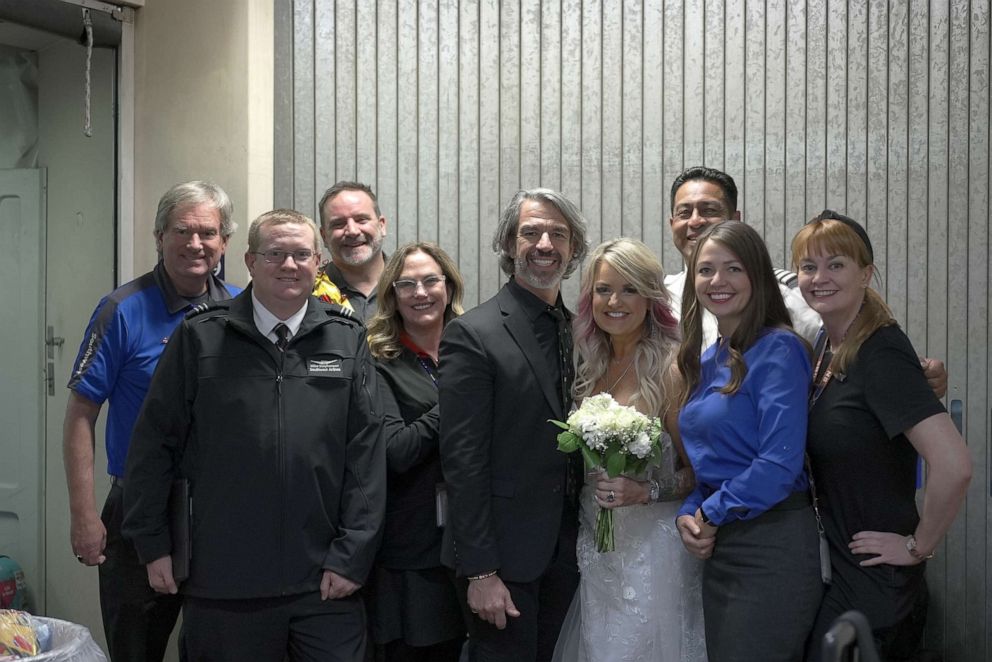 PHOTO:	Pam and Jeremy Salda were traveling to Las Vegas to get married when their flight was cancelled. With the help of the pilot's captain, flight crew and other passengers, the two were married about 37,000 feet in the air.