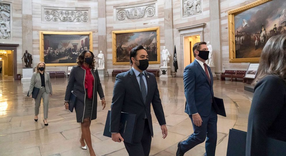 PHOTO: Rep. Eric Swalwell, right, Rep. Joaquin Castro, Rep. Ted Lieu, Delegate Stacey Plaskett, and Rep. Madeleine Dean, D-Pa., far left, walk to the Senate for the second impeachment trial of former President Donald Trump, Feb. 9, 2021, in Washington.