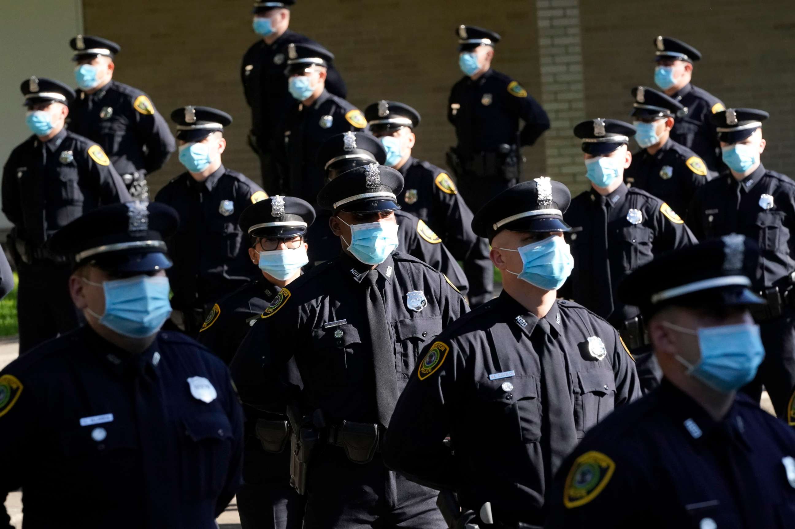 PHOTO: Houston Police cadets wear masks as they prepare to have their class photo taken during a graduation ceremony at the Houston Police Academy, amid the COVID-19 pandemic, Friday, May 1, 2020, in Houston.