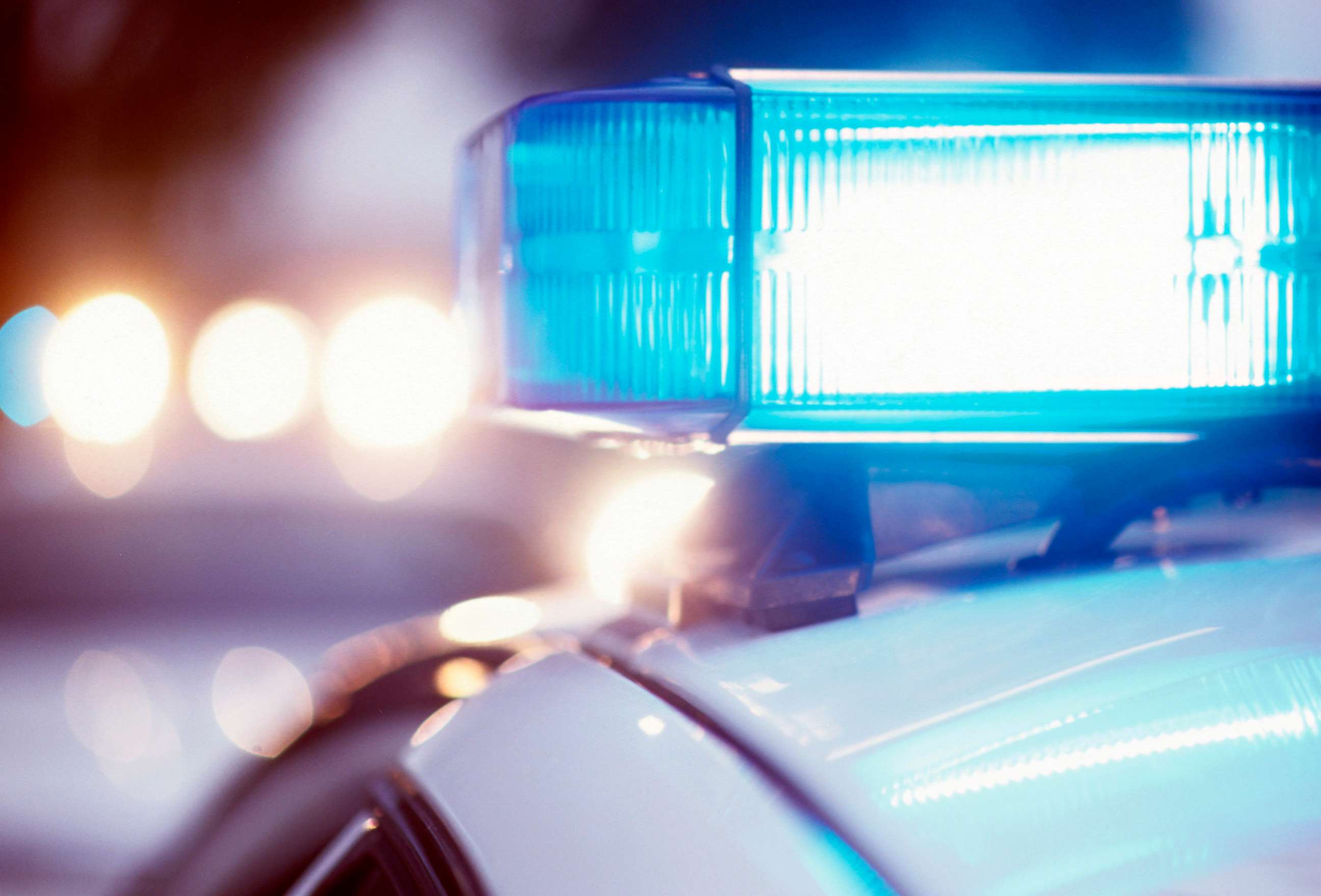 PHOTO: Police car with lights on at night.