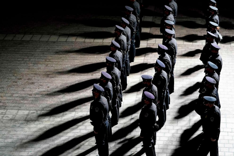 PHOTO: U.S. Capitol Police officers stand at attention as an urn with the cremated remains of Capitol Police officer Brian Sicknick arrives at the Capitol to the Rotunda where it will lie in honor in Washington, D.C., Feb. 2, 2021.