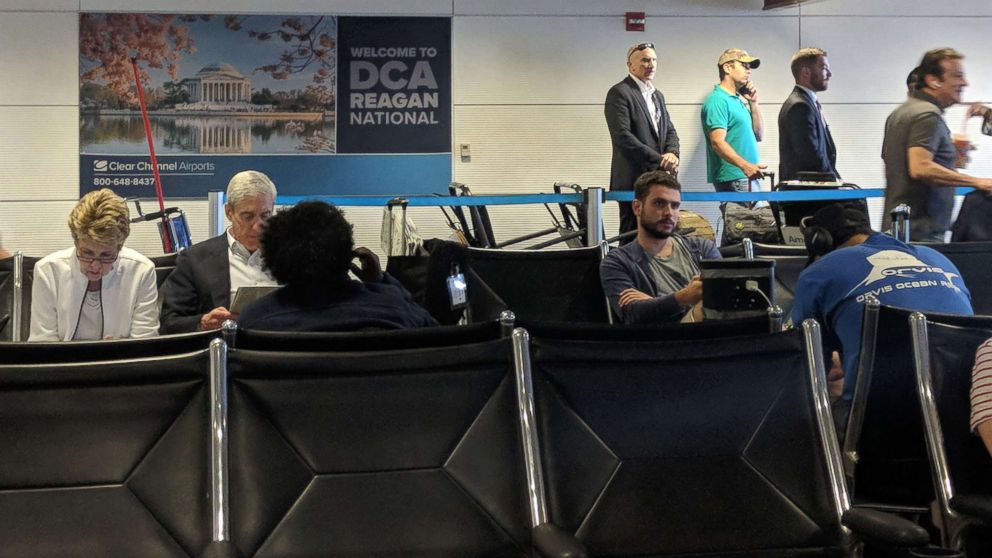Robert Mueller and Donald Trump Jr. wait at Reagan National Airport outside Washington, D.C., July 27, 2018.