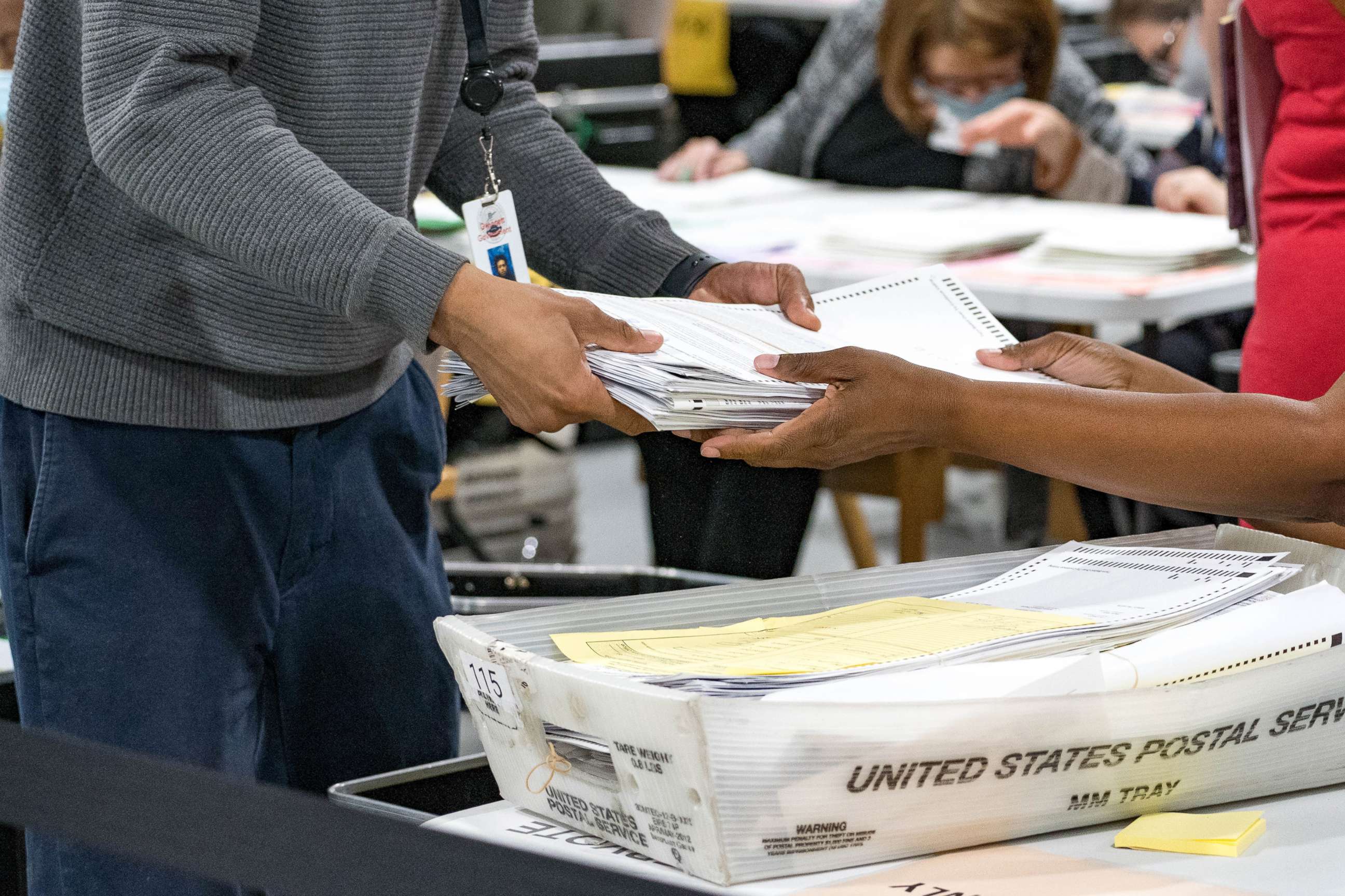 PHOTO: Gwinnett County election workers handle ballots as part of the recount for the 2020 presidential election at the Beauty P. Baldwin Voter Registrations and Elections Building, Nov. 16, 2020, in Lawrenceville, Georgia.