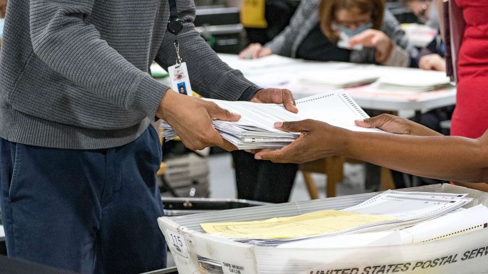 PHOTO: Gwinnett County election workers handle ballots as part of the recount for the 2020 presidential election at the Beauty P. Baldwin Voter Registrations and Elections Building, Nov. 16, 2020, in Lawrenceville, Georgia.