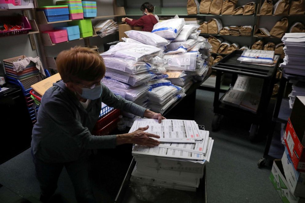 PHOTO: The election official Pam Hainault works in the ballot room organizing unused ballots returned from voting precincts after Election Day at the Kenosha Municipal Building in Kenosha, Wisconsin, Nov. 4, 2020.