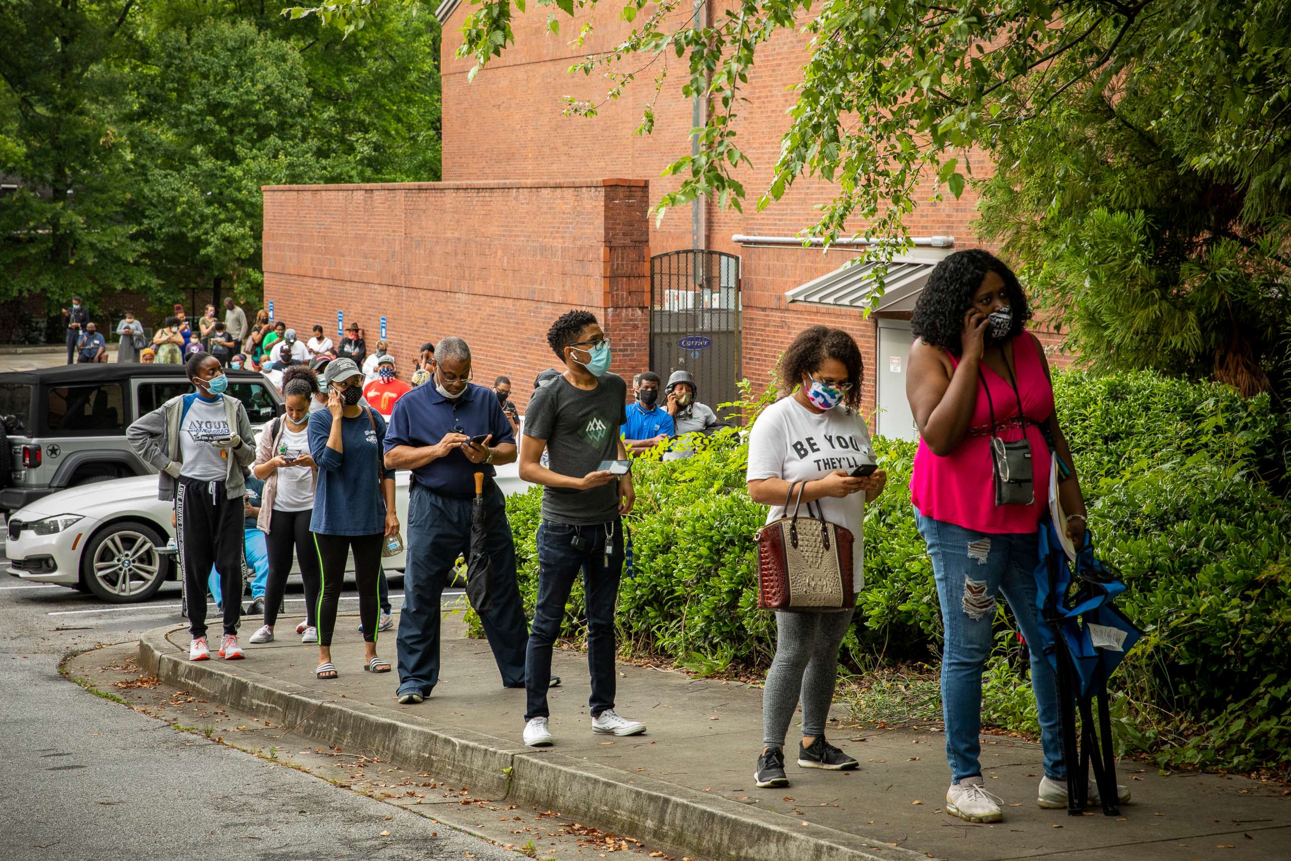 PHOTO: Voters wait in line at a polling place in Atlanta, June 5, 2020.