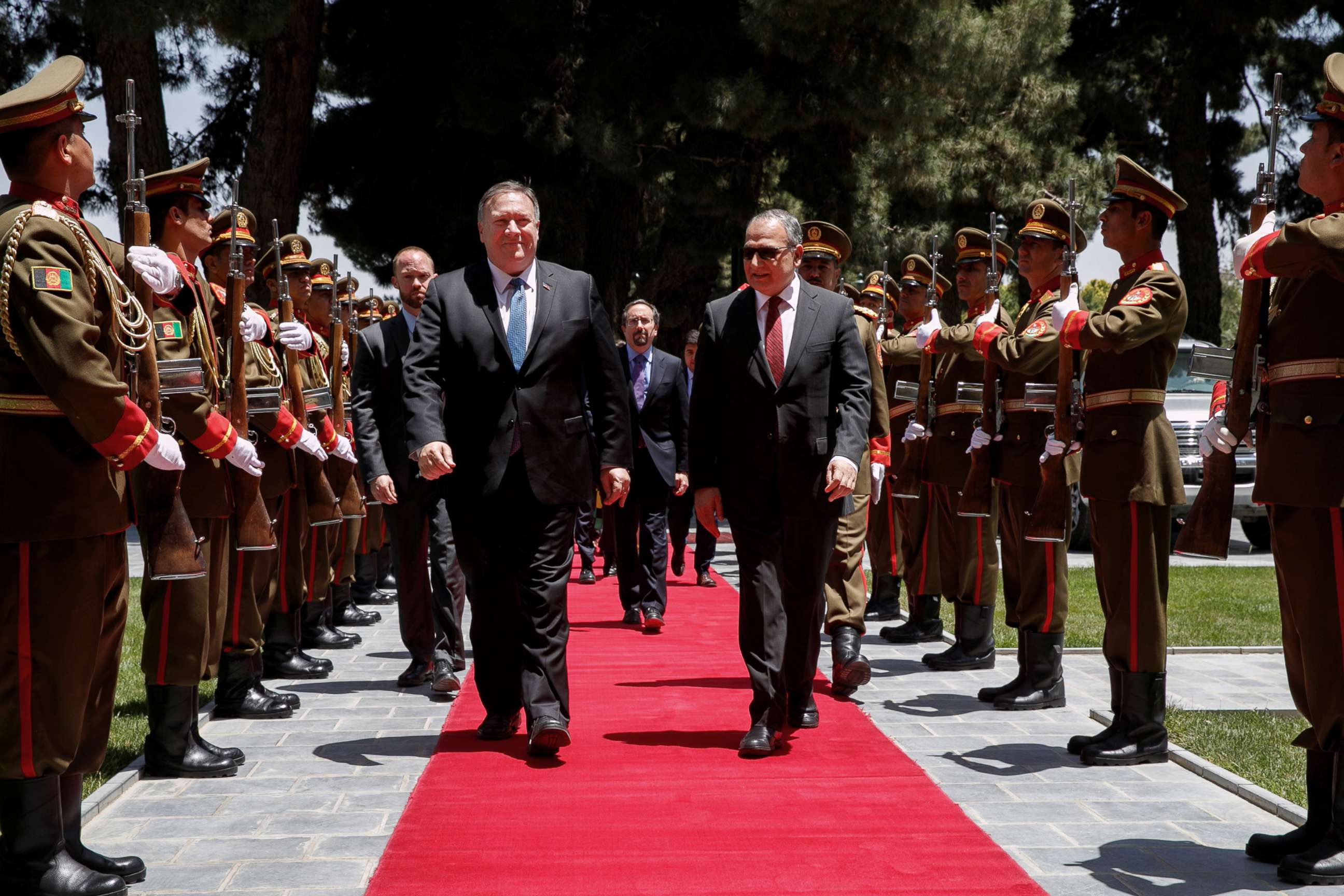 PHOTO: Secretary of State Mike Pompeo walks with Afghan President Ashraf Ghani's Chief of Staff Abdul Salam Rahimi, as he arrives at the Presidential Palace in Kabul, Afghanistan, June 25, 2019.