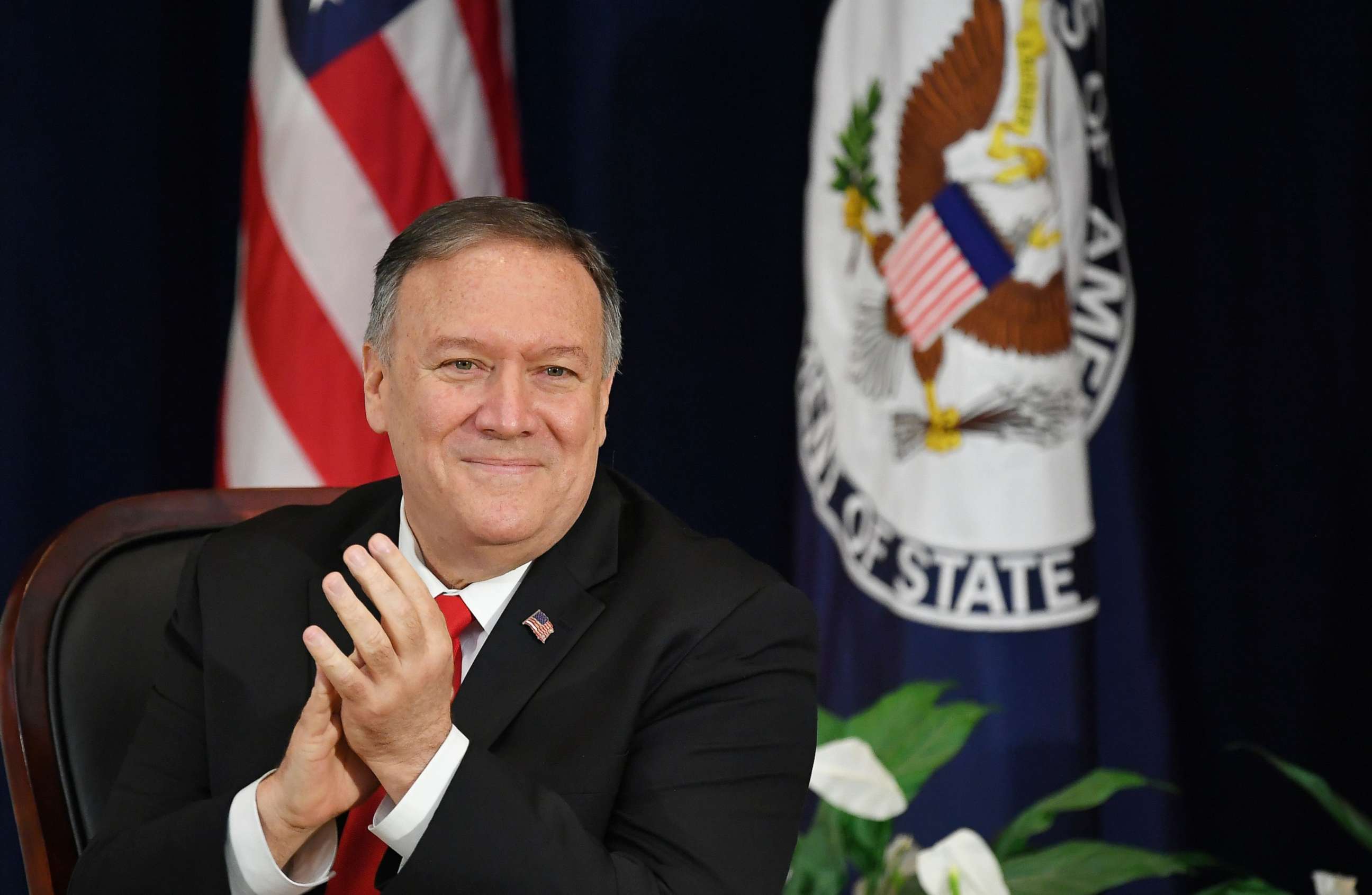 PHOTO: US Secretary of State Mike Pompeo applauds before giving a speech at the Heroes of US Diplomacy launch event at the State Department in Washington, DC on September 13, 2019.
