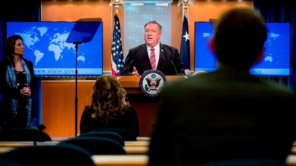 PHOTO: US Secretary of State Mike Pompeo, accompanied by State Department spokeswoman Morgan Ortagus(L) speaks at a news conference at the State Department on April 29, 2020, in Washington,DC.