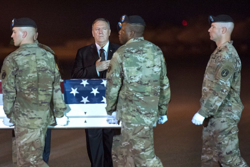 PHOTO: An Army carry team moves a transfer case containing the remains of Sgt. 1st Class Elis Barreto Ortiz, 34, from Morovis, Puerto Rico, past Secretary of State Mike Pompeo, Sept. 7, 2019.