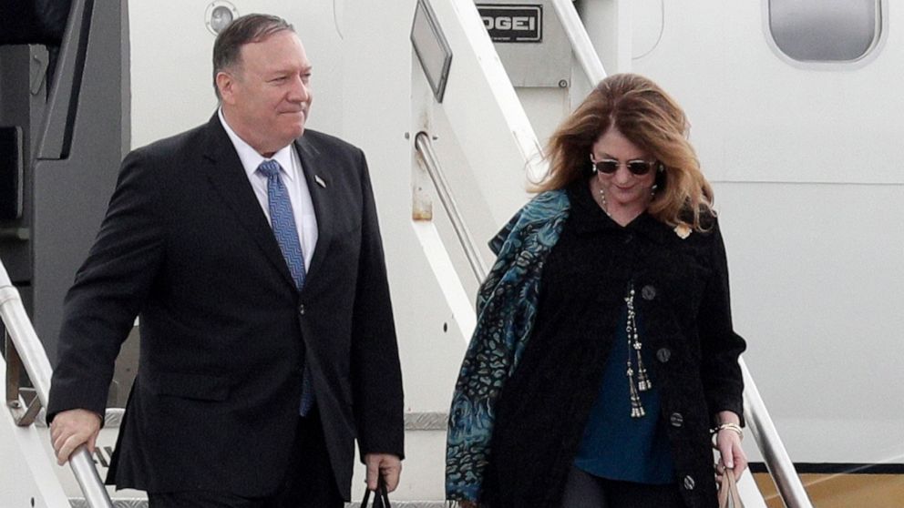 PHOTO: Secretary of State Mike Pompeo and his wife Susan Pompeo walk out of the plane upon arriving at Ciampino military airport, in Rome, Oct. 1, 2019.