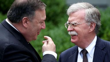 PHOTO: Secretary of State Mike Pompeo (left) talks with White House National Security Advisor John Bolton before a news conference with President Donald Trump and Japanese Prime Minister Shinzo Abe at the White House, on June 7, 2018, in Washington, D.C. 