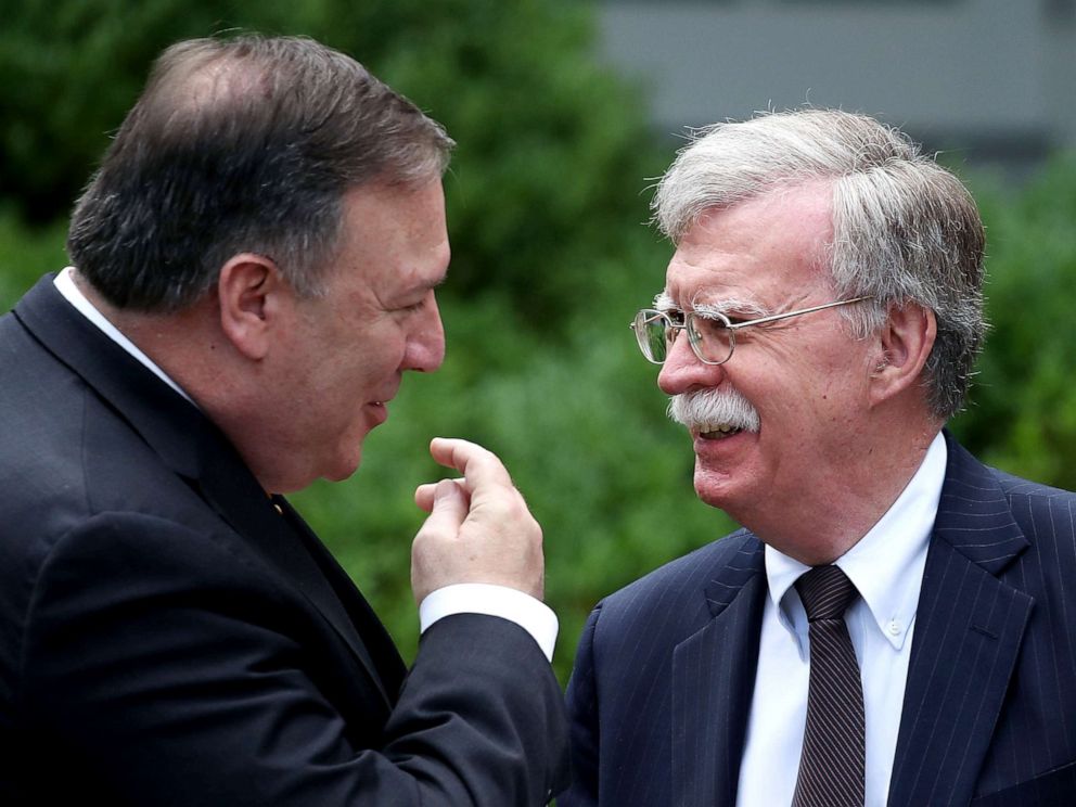 PHOTO: Secretary of State Mike Pompeo (left) talks with White House National Security Advisor John Bolton before a news conference with President Donald Trump and Japanese Prime Minister Shinzo Abe at the White House, on June 7, 2018, in Washington, D.C. 