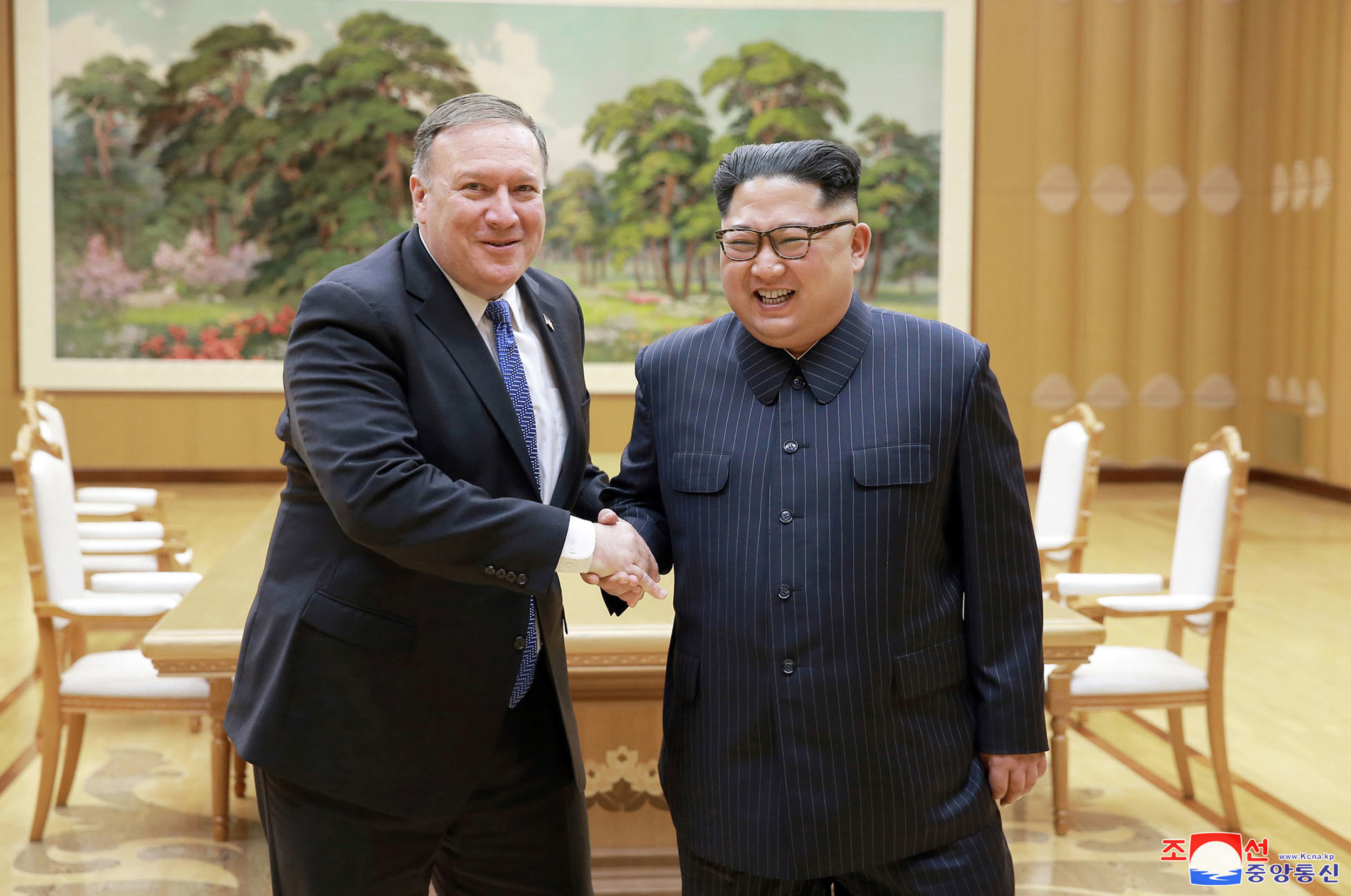 PHOTO: Secretary of State Mike Pompeo, left, shakes hands with North Korean leader Kim Jong Un during a meeting at Workers' Party of Korea headquarters in Pyongyang, North Korea,  May 8, 2018.
