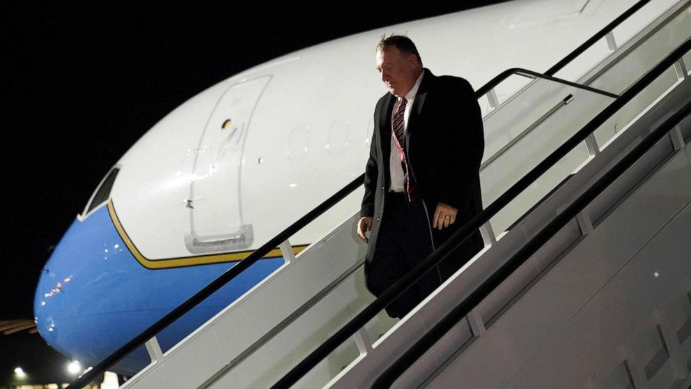 PHOTO: Secretary of State Mike Pompeo steps from his plane upon arrival at Stansted Airport, north east of London, on Jan. 29, 2020.