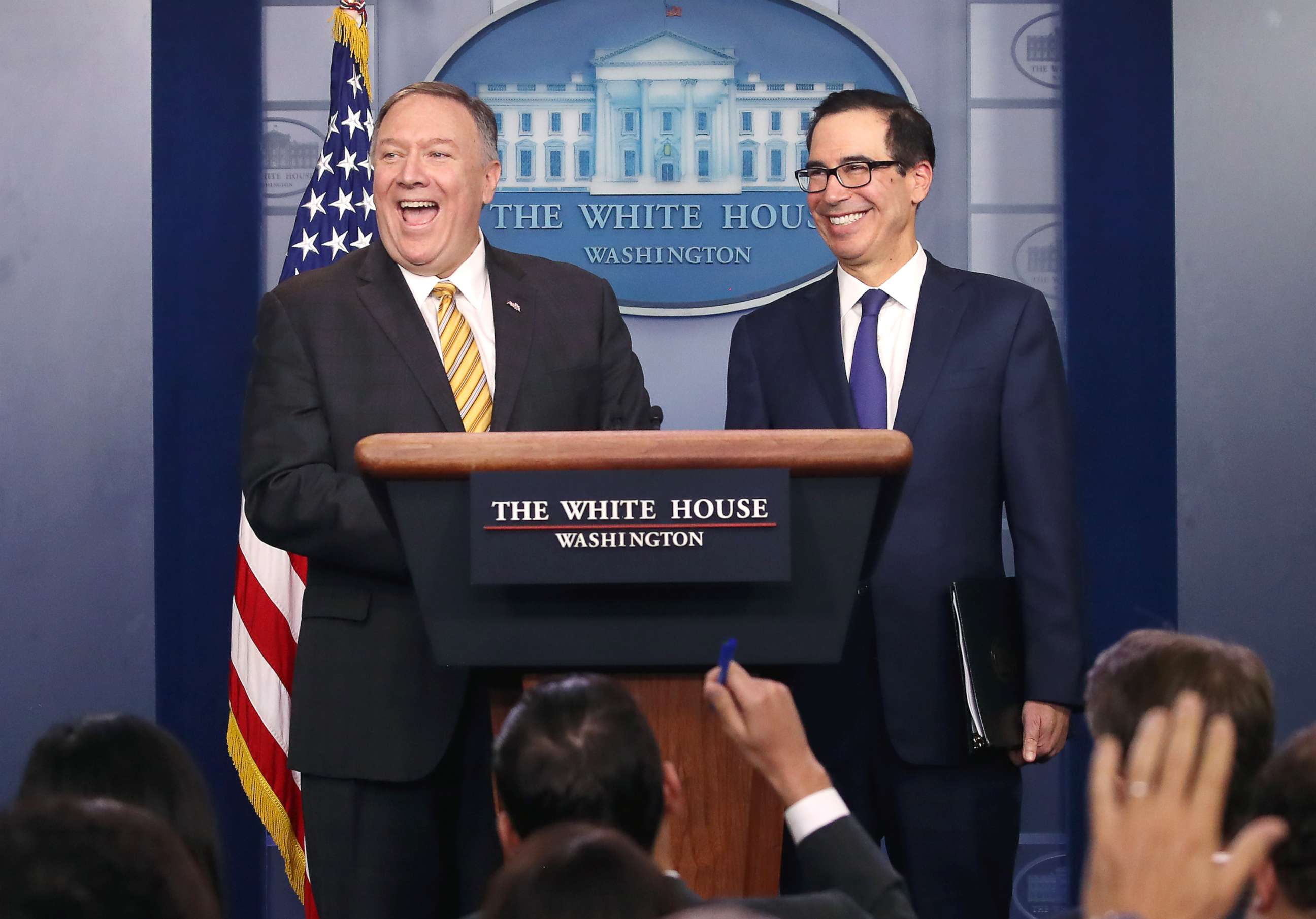 PHOTO: Secretary of State Mike Pompeo and Treasury Secretary Steven Mnuchin laugh in the James Brady briefing room at the White House, Sept. 10, 2019. 