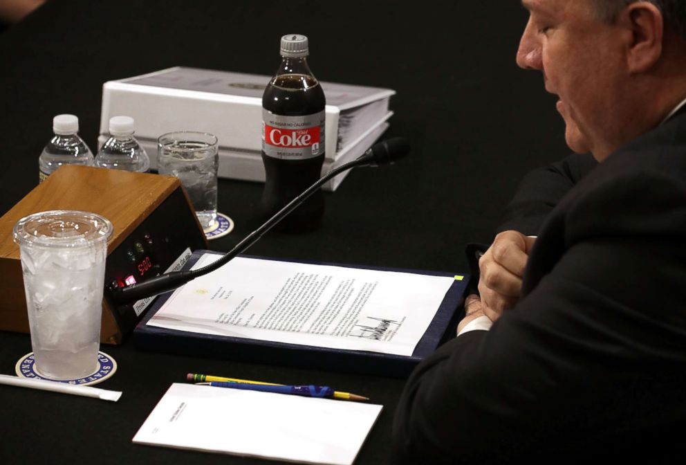 PHOTO: Secretary of State Mike Pompeo reads President Donald Trump's letter to North Korean leader Kim Jong Un before Pompeo testifies to the Senate Foreign Relations Committee, May 24, 2018 in Washington, DC. 