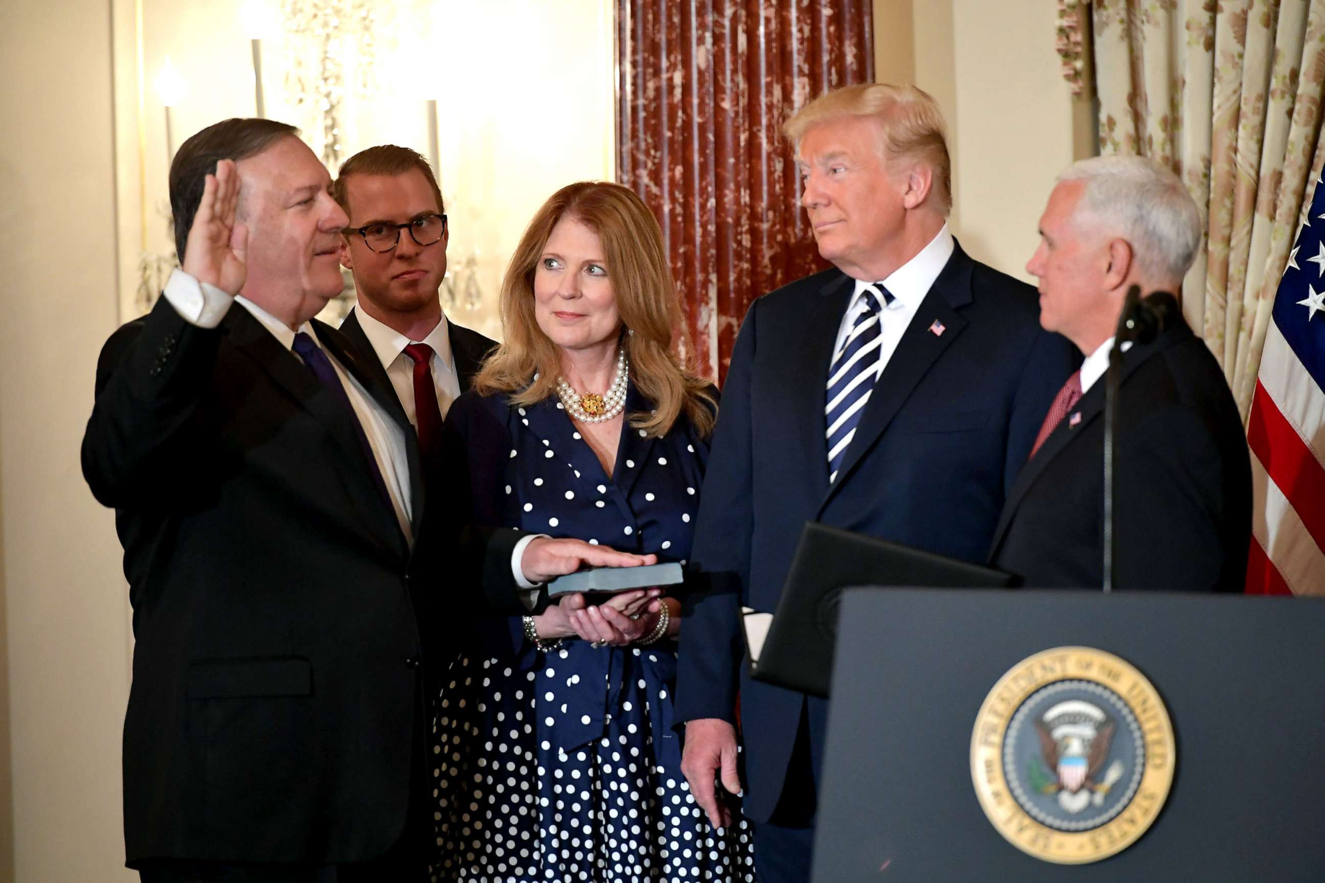 PHOTO: President Donald Trump watches Mike Pompeo take the oath during his ceremonial swearing-in as US Secretary of State, as Susan Pompeo, Nick Pompeo and US Vice President Mike Pence look on in Washington, DC, May 2, 2018.