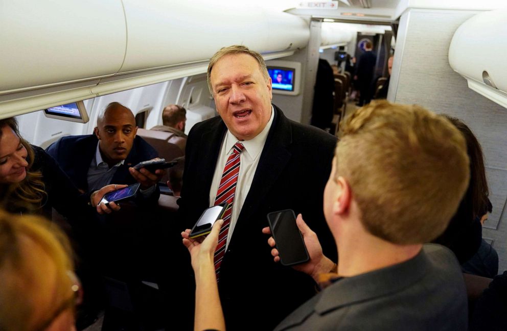PHOTO: Secretary of State Mike Pompeo speaks to reporters aboard his plane en route to London, Jan. 29, 2020.